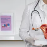 front view doctor holding anatomic model (1) (2)